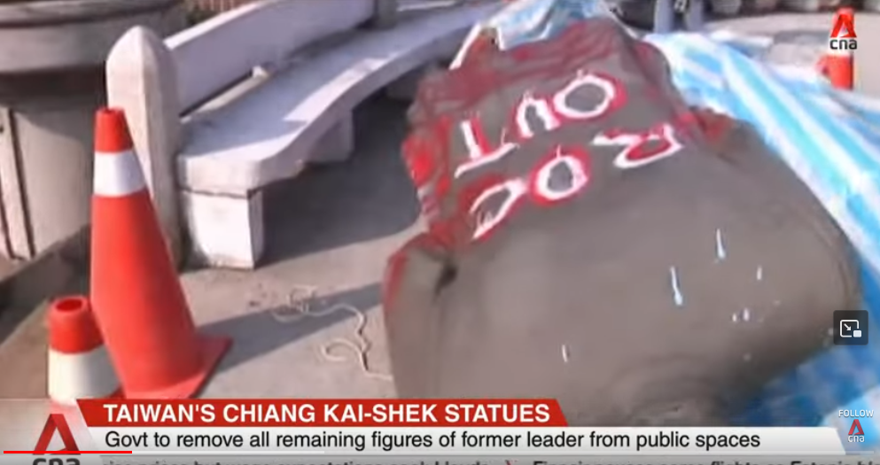 Chiang Kai-shek statue tipped over with "ROC OUT" scrawled on back