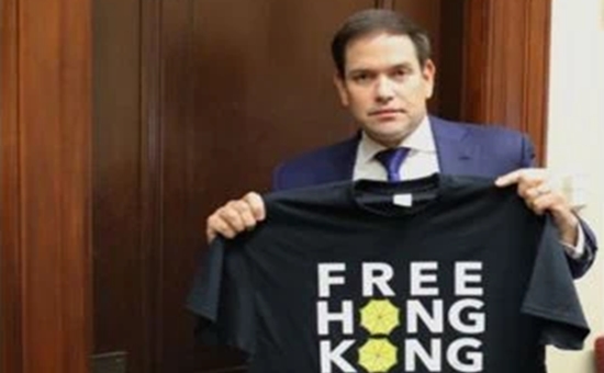 Marco Rubio holding a Free Hong Kong T-shirt